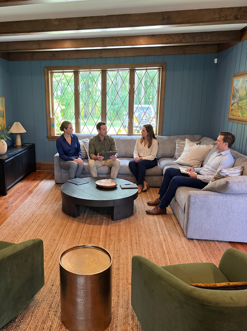 A small team in a relaxed meeting on a corporate retreat at Greystone Estate